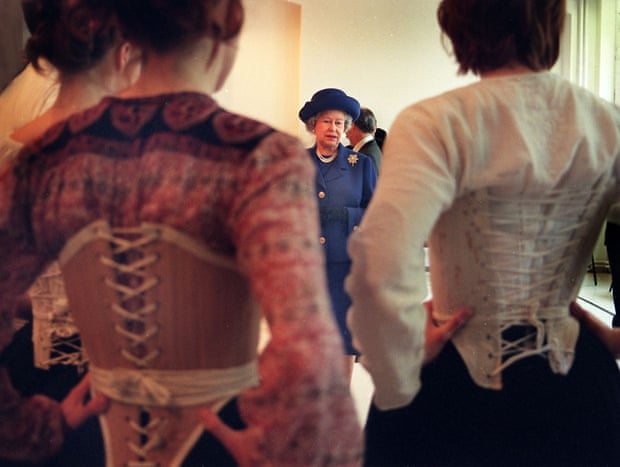 Queen Elizabeth II admires costumes worn by Rada students as part of a tour of London's theatres in March 1999.