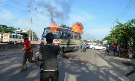 Jamaat-e-Islami supporters set fire to a bus in protest at sentences handed down by a war crimes tribunal in 2013