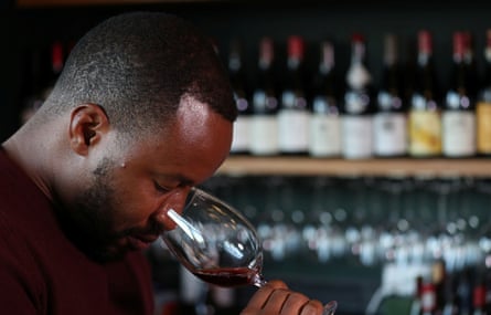 Tinashe Nyamudoka sniffs a glass of wine