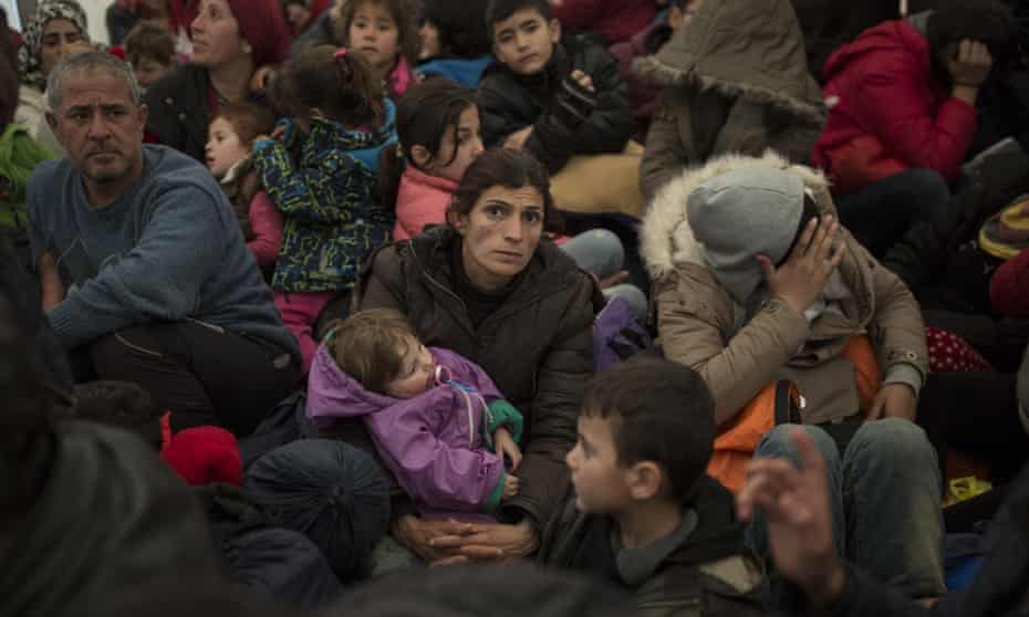Refugee and migrant families queue to enter Macedonia at the Greek-Macedonia border near Idomeni, Greece.