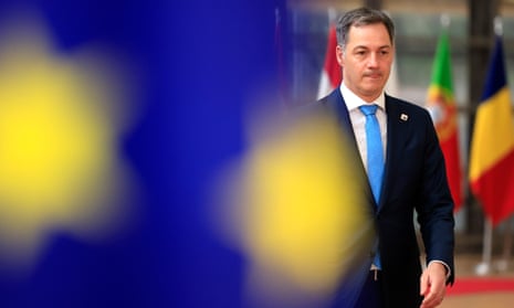 Belgium's prime minister Alexander De Croo behind an EU flag