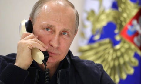 President Putin speaks on the telephone.