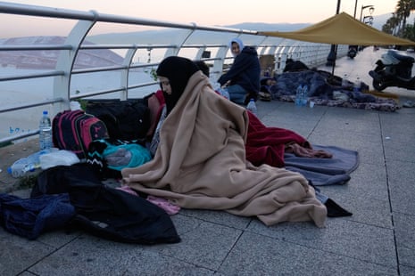 Displaced people fleeing Israeli airstrikes in Beirut’s southern suburb of Dahiyeh sleep near the city coast.