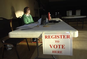 Sue Randle waits for voters to register at a polling place in Normal, Illinois on 17 March.