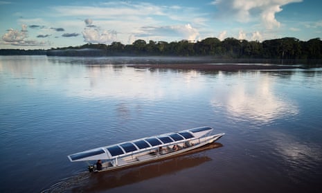 Sunkirum, one of the solar-powered canoes, sails on the Pastaza river