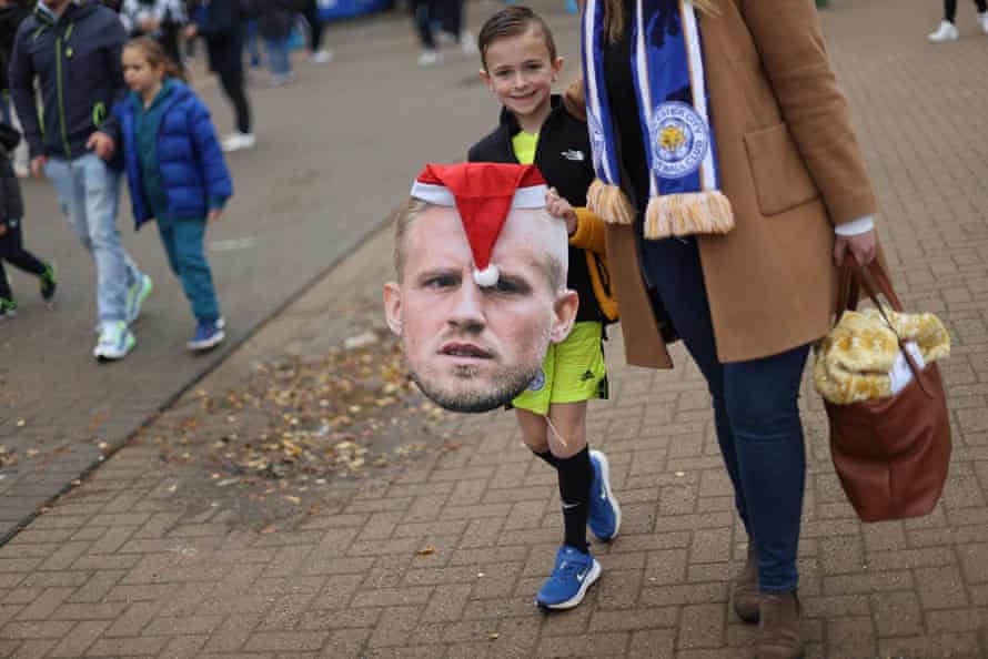 A young Leicester City fan carrying an image of Kasper Schmeichel’s head before a match against Newcastle on December 12 that Leicester won 4-0.