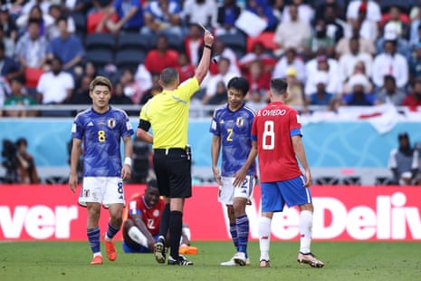 Miki Yamane is shown a yellow card by referee Michael Oliver.