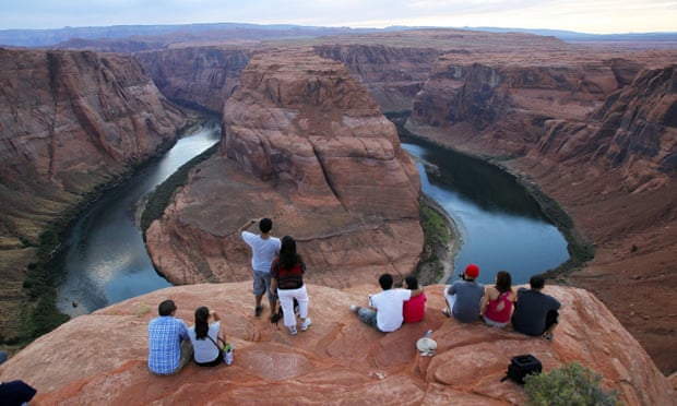 Visitors view the Colorado River’s Horseshoe Bend in Glen Canyon national recreation area