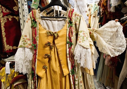 A member of staff of Nicolao Atelier shows a 1700 replica costume