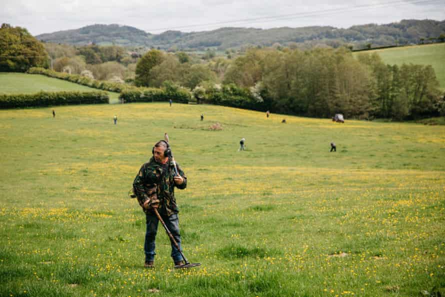 Adrian Harris scours the fields near Ledbury, Herefordshire. He says he got into the hobby watching the Time Team TV show