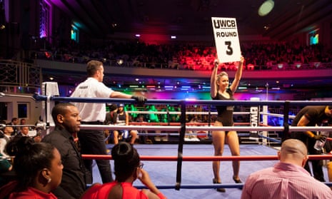 A ring girl signals the beginning of round 12 during the WBO