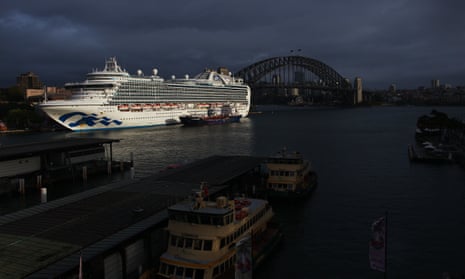 massive cruise ship at port at circular quay with harbour bridge behind
