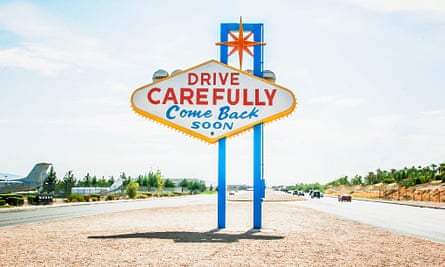 Road sign in Vegas saying Drive Carefully Come Back Soon
