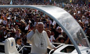Pope Francis waves at well-wishers as he arrives at the Catholic shrine of Fátima.