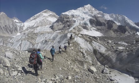 Trekkers cross a glacier at Mount Everest base camp