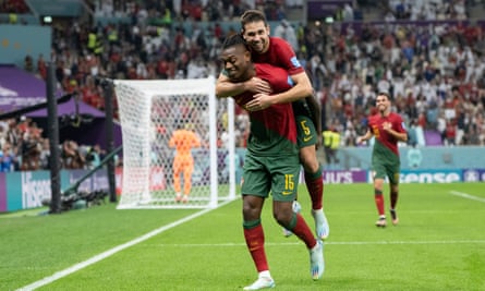Rafael Leão of Portugal celebrates scoring his side’s sixth goal, with Raphaël Guerreiro on his back