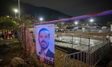 a picture of Jorge Álvarez Máynez hangs on railings near the collapsed stage