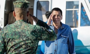 Philippines President Rodrigo Duterte salutes to a military officer