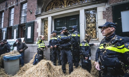 Farmers in Groningen attack the police with strawepa07920121 Police officers are harassed with straw during the farmer’s protest in front of the provincial government building in Groningen, The Netherlands, 14 October 2019. The representative of Agricultural and Horticultural Organisation (LTO) called for action and demanded a suspension of the nitrogen policy rules. EPA/SIESE VEENSTRA