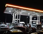 ‘This petrol station is my home now’: Malawi’s fuel crisis forces desperate drivers to queue for da…