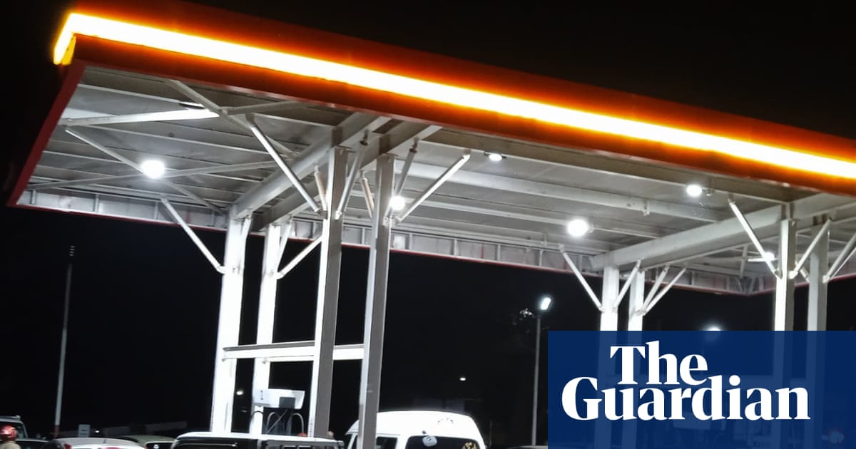 ‘This petrol station is my home now’: Malawi’s fuel crisis forces desperate drivers to queue for days