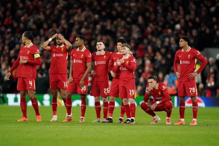 Liverpool players look on during the penalty shootout defeat by PSG
