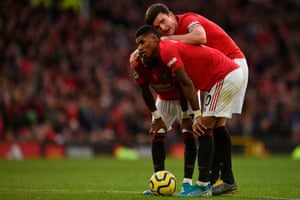 Harry Maguire plots a free-kick routine against Broghton with Marcus Rashford and Fred.