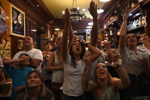 Madrid, Spain: Real Madrid supporters react in a bar in Madrid during the UEFA Champions League final football match between Liverpool and Real Madrid taking place at the Stade de France in Saint-Denis, Paris
