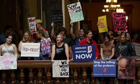 Pro-choice and anti-abortion activists protest in the Indiana statehouse during a special session debating on banning abortion in Indianapolis, Indiana on 25 July 25 2022.