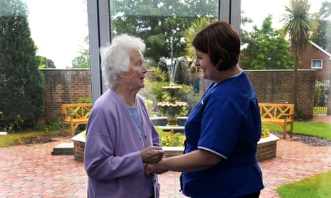 A resident with a carer at a care home in North Walsham, Norfolk.