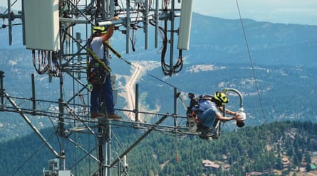 People installing cameras high in the air