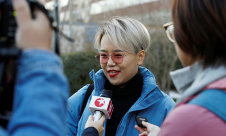 Teresa Xu talks to journalists outside a Beijing court.