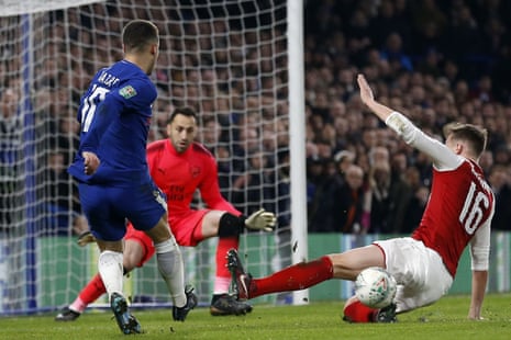 Arsenal’s Rob Holding manages to block this attempt from Chelsea’s Eden Hazard.