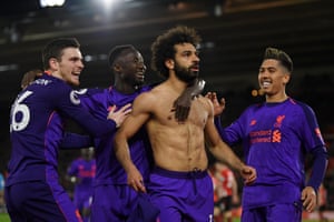 Salah celebrates with Firmino and Robertson.