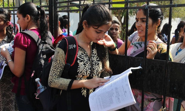 A student does some last minute revising before sitting her Secondary School Certificate (SSC) in Mumbai.