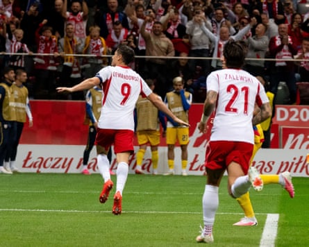 Robert Lewandowski scores from the penalty spot to kick off Poland's 6-0 rout of Romania.