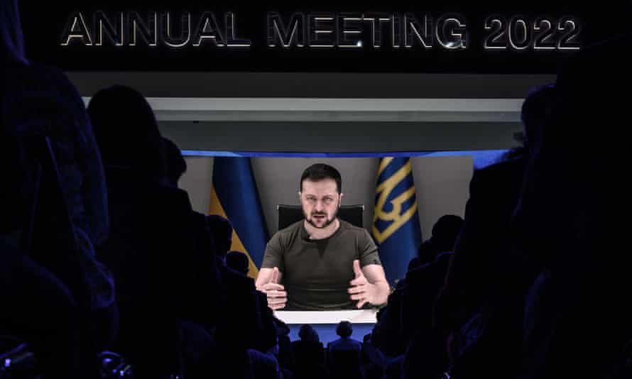 Ukrainie’s President Volodymyr Zelenskiy appears on a giant screen during his address by video conference as part of the World Economic Forum (WEF) annual meeting in Davos.