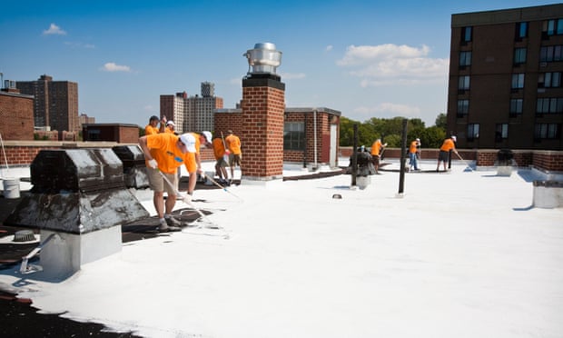 A New York rooftop being coated with reflective paint.