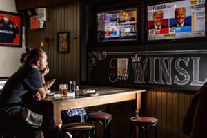 People watch election results at the Winslow in Manhattan, New York on 3 November.