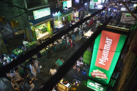 An illuminated sign for Myanmar Beer, manufactured by Myanmar Brewery Ltd, owned by MEHL, in Yangon