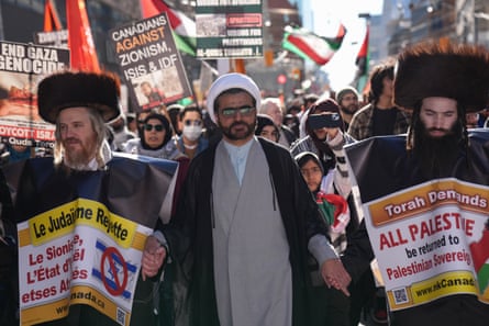 Pro-Palestinian demonstrators march during a rally in Toronto on 6 April.