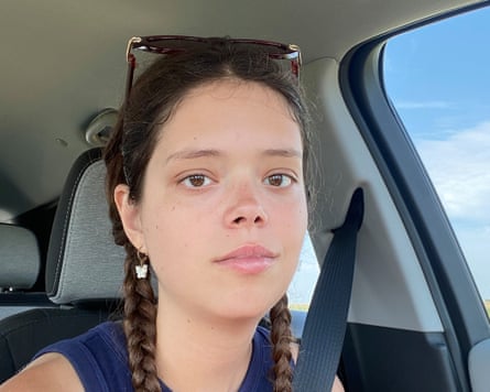 a person in braids and sunglasses