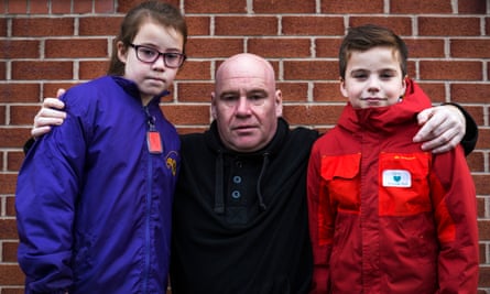 Mark Stacey with his children, Conall and Stacey, after refusing to cross the Unison picket line at Lakeside Community School, Derby.