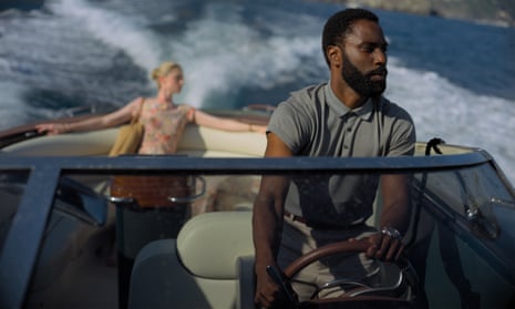 This image released by Warner Bros. Entertainment shows Elizabeth Debicki, left, and John David Washington in a scene from “Tenet.” Warner Bros. will release Christopher Nolan’s “Tenet” internationally first on Aug. 26, with a U.S. release in select cities to follow over Labor Day weekend. Warner Bros. (Melinda Sue Gordon/Warner Bros. Entertainment via AP)