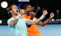Rohan Bopanna (right) and Matthew Ebden celebrate winning the men's doubles final.