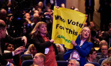 Activists protest as the prime minister, Liz Truss, made her speech to the Conservative conference in Birmingham