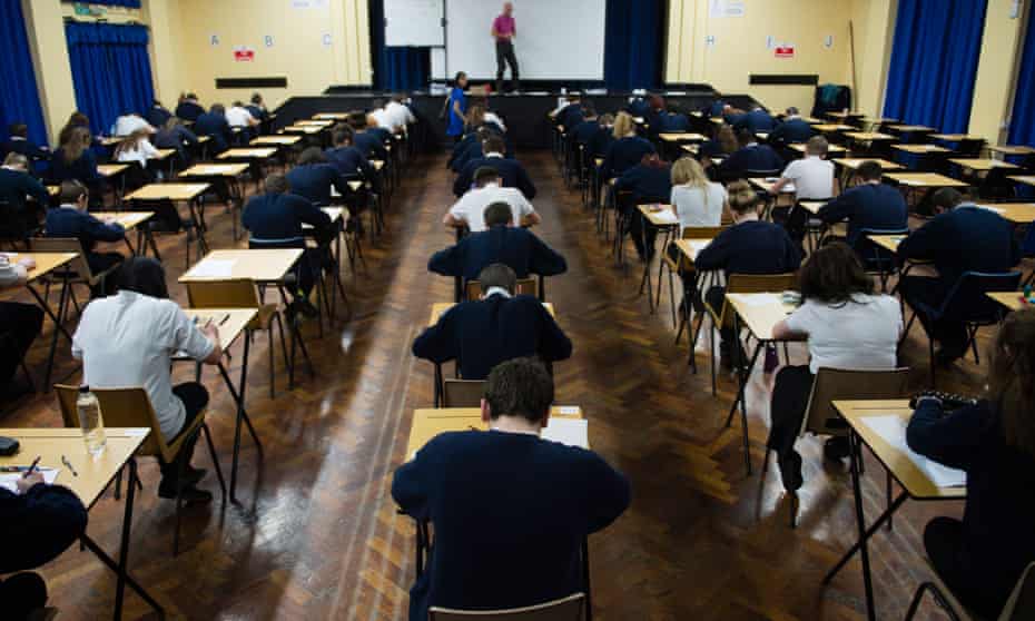 Pupils sitting GCSE exams in a school hall