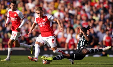 Martin Ødegaard tries to find a way past Manchester United’s Aaron Wan-Bissaka at the Emirates