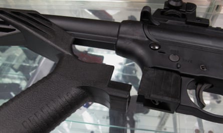 A ‘bump’ stock lies next to a disassembled .22-caliber rifle at North Raleigh Guns in Raleigh, North Carolina.