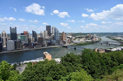 An aerial view of downtown Pittsburgh, Pennsylvania, which has a river going through it.